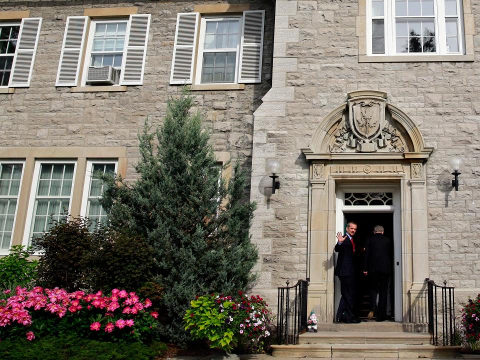 Canadian astronaut Chris Hadfield waves as he enters 24 Sussex Drive in Ottawa June 10, 2013.