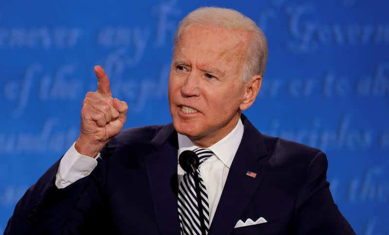 FILE PHOTO: U.S. President Donald Trump and Democratic presidential nominee Joe Biden participate in their first 2020 presidential campaign debate in Cleveland