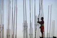 A laborer works in a construction site in Yangon, January 24, 2012.