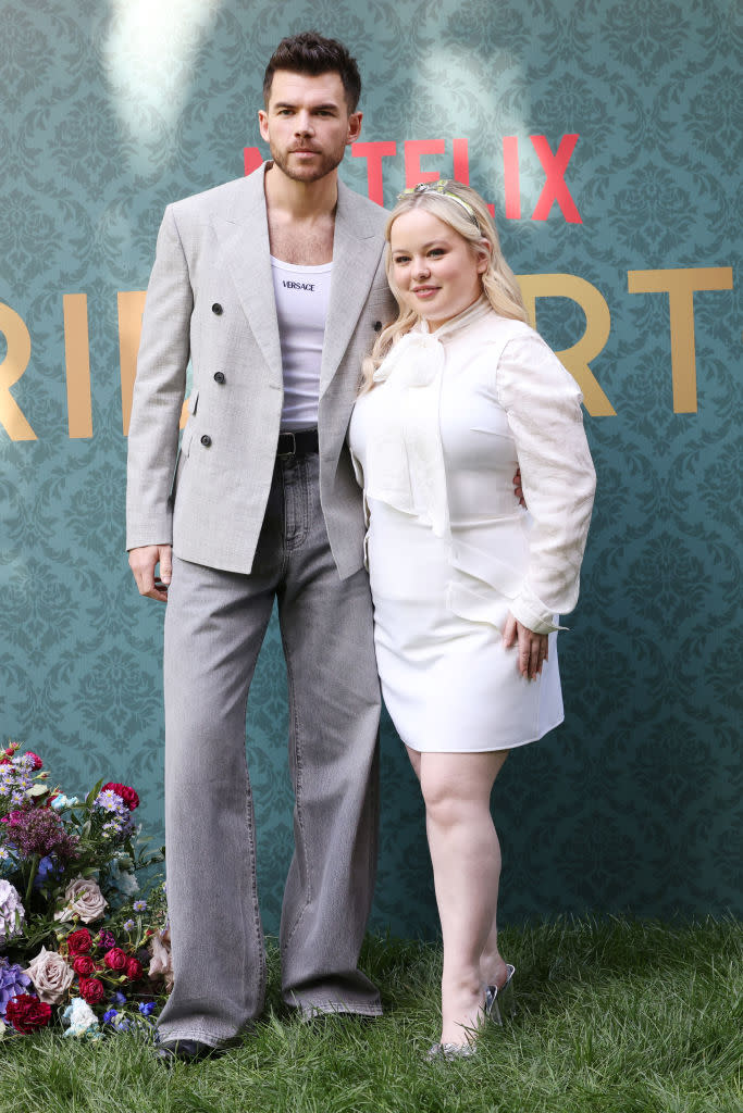 Luke Newton and Nicola Coughlan attend a photo call for "Bridgerton" season three on May 9 in Milan, Versace, red carpet, Netflix