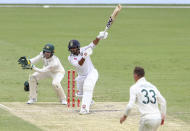 India's Shardul Thakur bats during play on day three of the fourth cricket test between India and Australia at the Gabba, Brisbane, Australia, Sunday, Jan. 17, 2021. (AP Photo/Tertius Pickard)