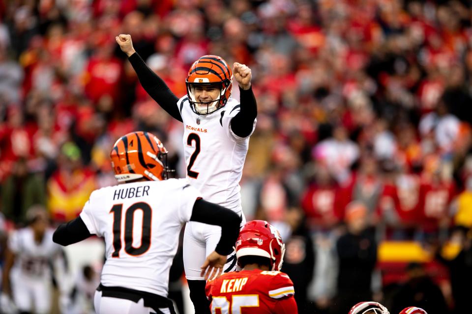 Cincinnati Bengals kicker Evan McPherson (2) celebrates with punter Kevin Huber (10) after hitting the game-winning field goal in overtime of the AFC championship NFL football game, Sunday, Jan. 30, 2022.