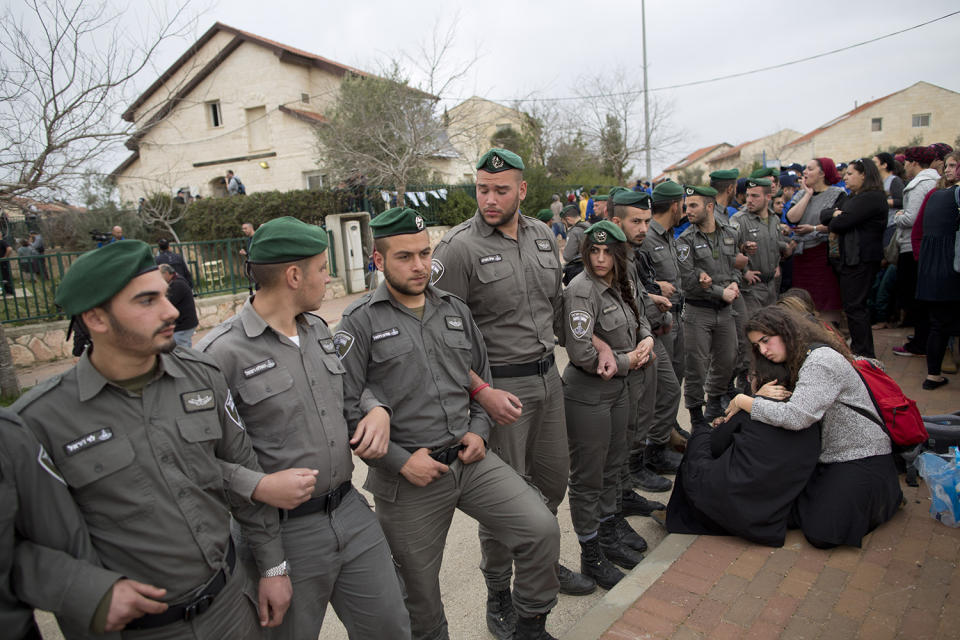 <p>Israeli police forms a a line in the West Bank settlement of Ofra, Tuesday, Feb. 28, 2017. Israeli forces began evacuating nine homes in the settlement following a Supreme Court decision that ruled they were built on private Palestinian land. (AP Photo/Oded Balilty) </p>