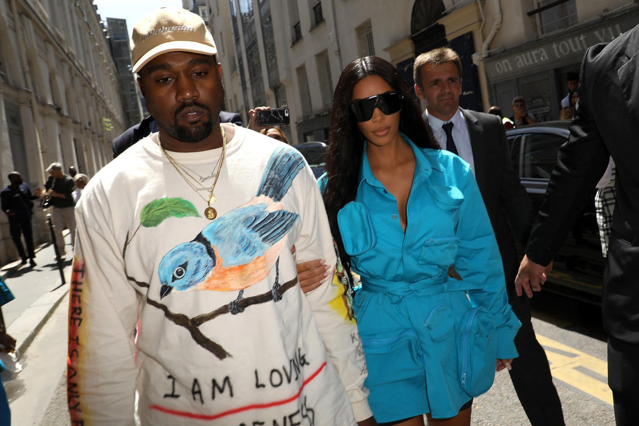 Kim Kardashian and Kanye West arrive at the Louis Vuitton Menswear Spring/Summer 2019 show on Thursday. (Photo: Pierre Suu via Getty Images)