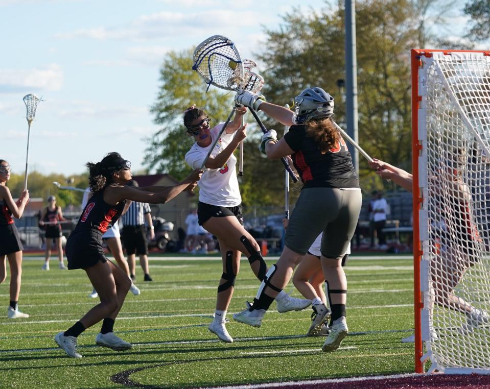 Pawling goalie Lexi Knowles (94) blocks a shot by Arlington's Jess Owens (5) during girls lacrosse action at Arlington High School in LaGrangeville on Saturday, May 6, 2023.