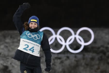 Biathlon - Pyeongchang 2018 Winter Olympics - Women's 15km Individual Final - Alpensia Biathlon Centre - Pyeongchang, South Korea - February 15, 2018 - Gold medalist Hanna Oeberg of Sweden celebrates during the victory ceremony. REUTERS/Murad Sezer