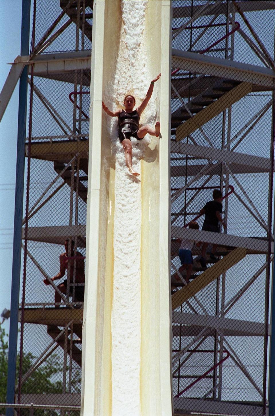 In this June 1999 photo, Lilia Carrera, 19, nearly loses control as she slides down the tallest slide at the Manteca Waterslide park.