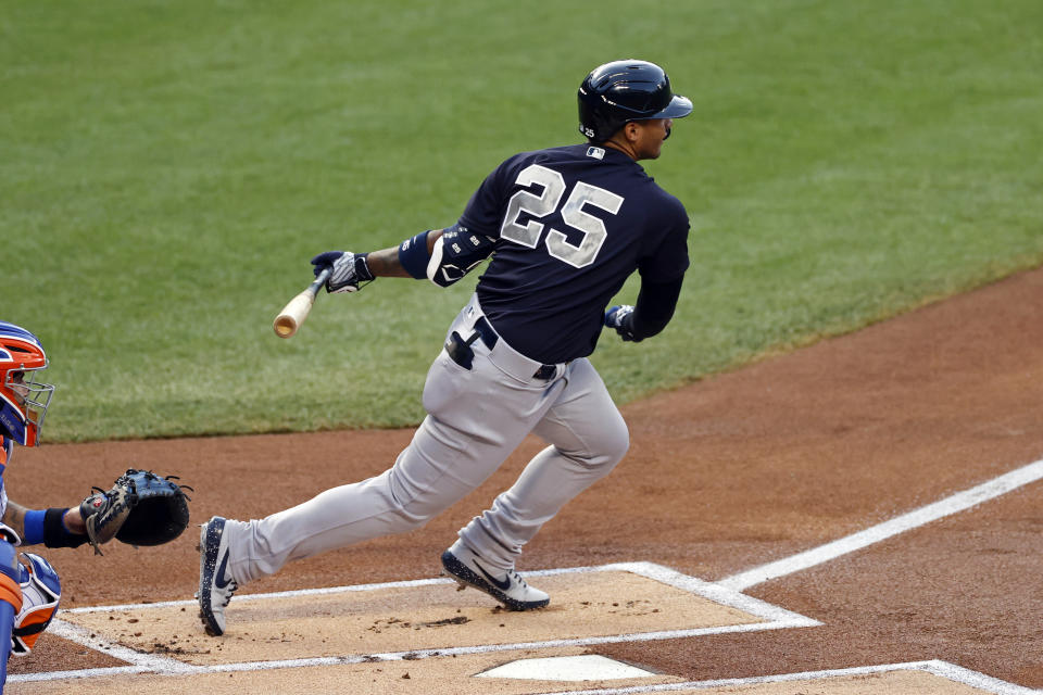 New York Yankees Gleyber Torres (25) hits an RBI single against the New York Mets during the first inning of a baseball spring training game Saturday, July 18, 2020, in New York. (AP Photo/Adam Hunger)