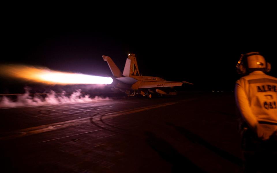 A fighter jet is launched from the US Navy aircraft carrier USS Dwight D. Eisenhower