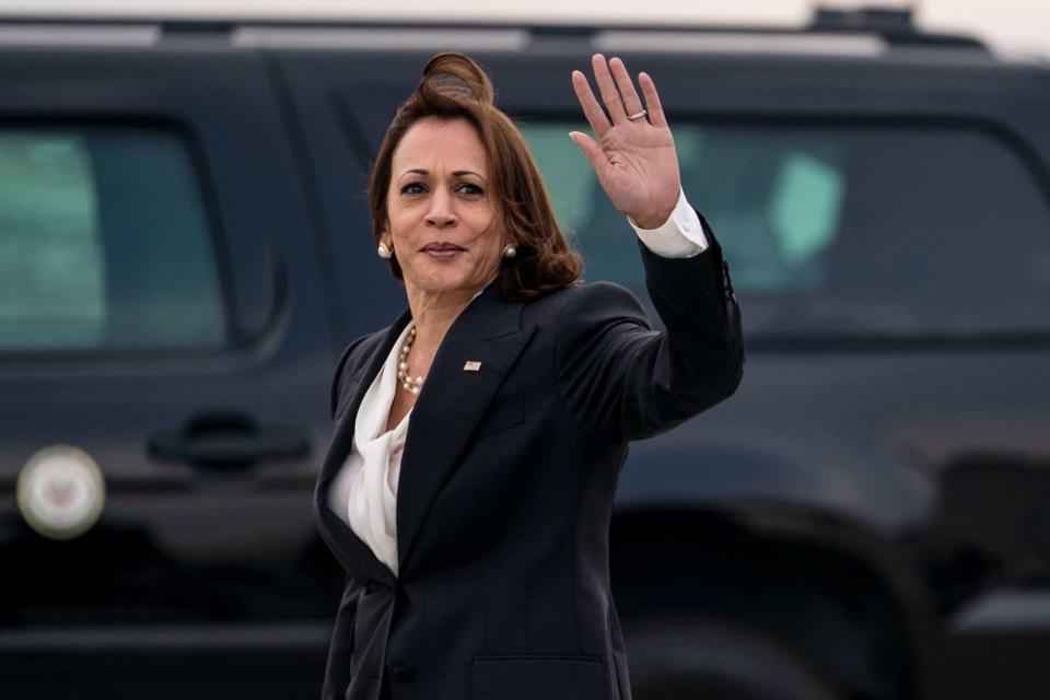 Kent Nishimura / Los Angeles Times via Getty Vice President Kamala Harris waves after disembarking Air Force 2 on April 18, 2022