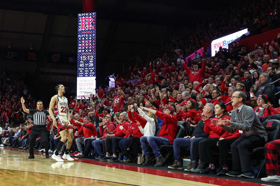 Rutgers Scarlet Knights guard Caleb McConnell (22) celebrates after a three point basket during the second half against the Minnesota Golden Gophers at Jersey Mike's Arena.