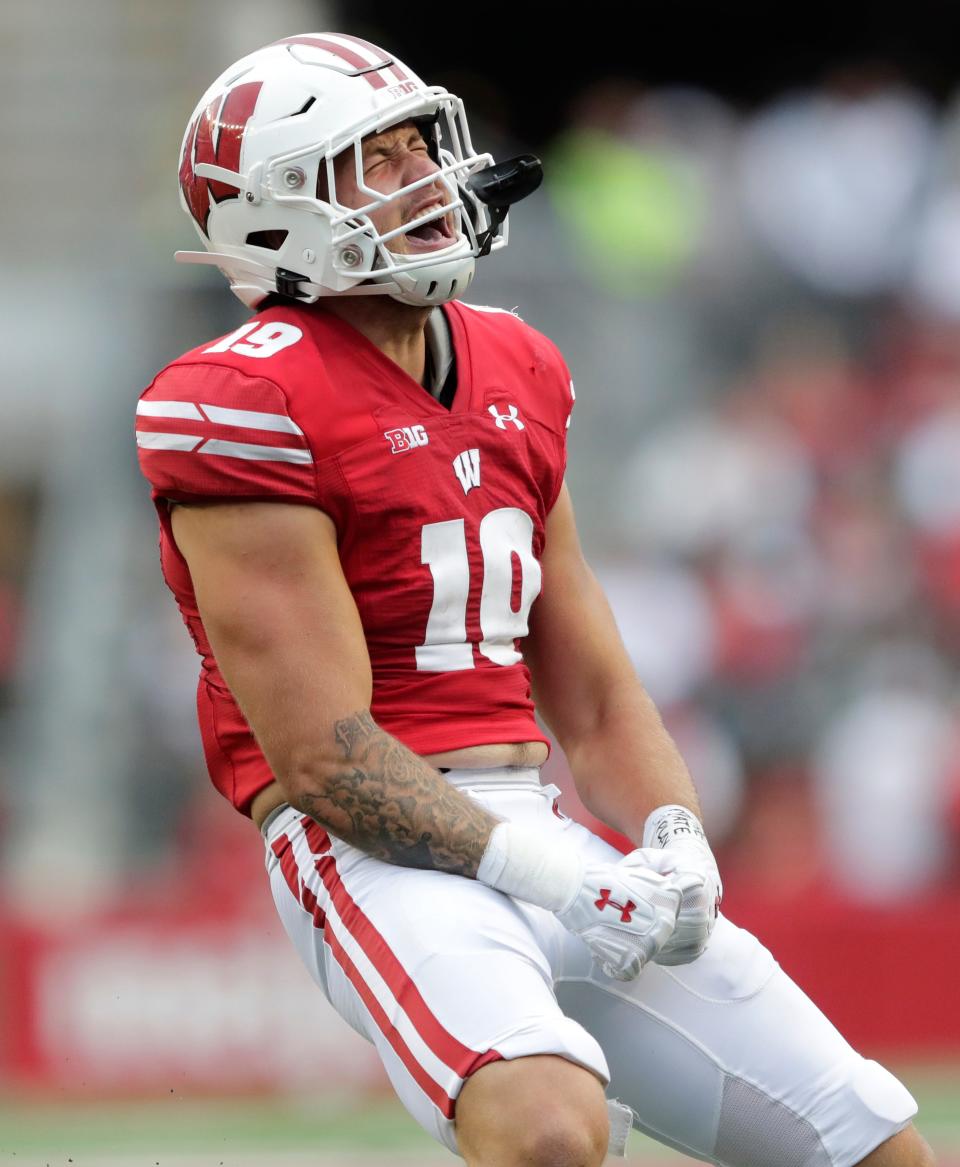 Wisconsin linebacker Nick Herbig celebrates getting a sack against Washington State.