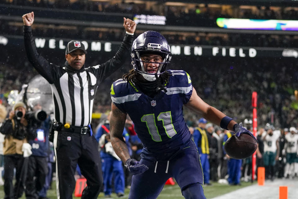Seattle Seahawks wide receiver Jaxon Smith-Njigba (11) reacts after scoring on a touchdown catch against the Philadelphia Eagles during the second half of an NFL football game, Monday, Dec. 18, 2023, in Seattle. The Seahawks won 20-17. (AP Photo/Lindsey Wasson)