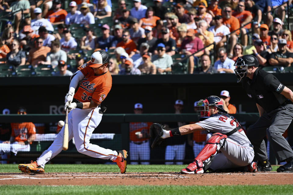 Baltimore Orioles' Adley Rutschman hits a single against Boston Red Sox starting pitcher Michael Wacha during the first inning of a baseball game, Saturday, Aug 20, 2022, in Baltimore. (AP Photo/Terrance Williams)