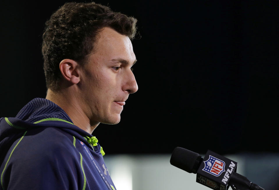Texas A&M quarterback Johnny Manziel answers a question during a news conference at the NFL football scouting combine in Indianapolis, Friday, Feb. 21, 2014. (AP Photo/Michael Conroy)