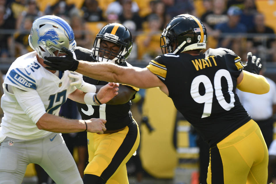 Pittsburgh Steelers linebacker T.J. Watt (90) gets a hand on Detroit Lions quarterback Tim Boyle (12) as he pressures him during the first half of an NFL preseason football game, Sunday, Aug. 28, 2022, in Pittsburgh. No penalty was called. (AP Photo/Don Wright)