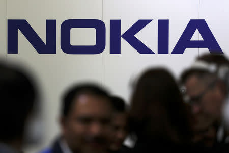 FILE PHOTO: Visitors gather outside the Nokia booth at the Mobile World Congress in Barcelona, Spain, February 26, 2019. REUTERS/Sergio Perez