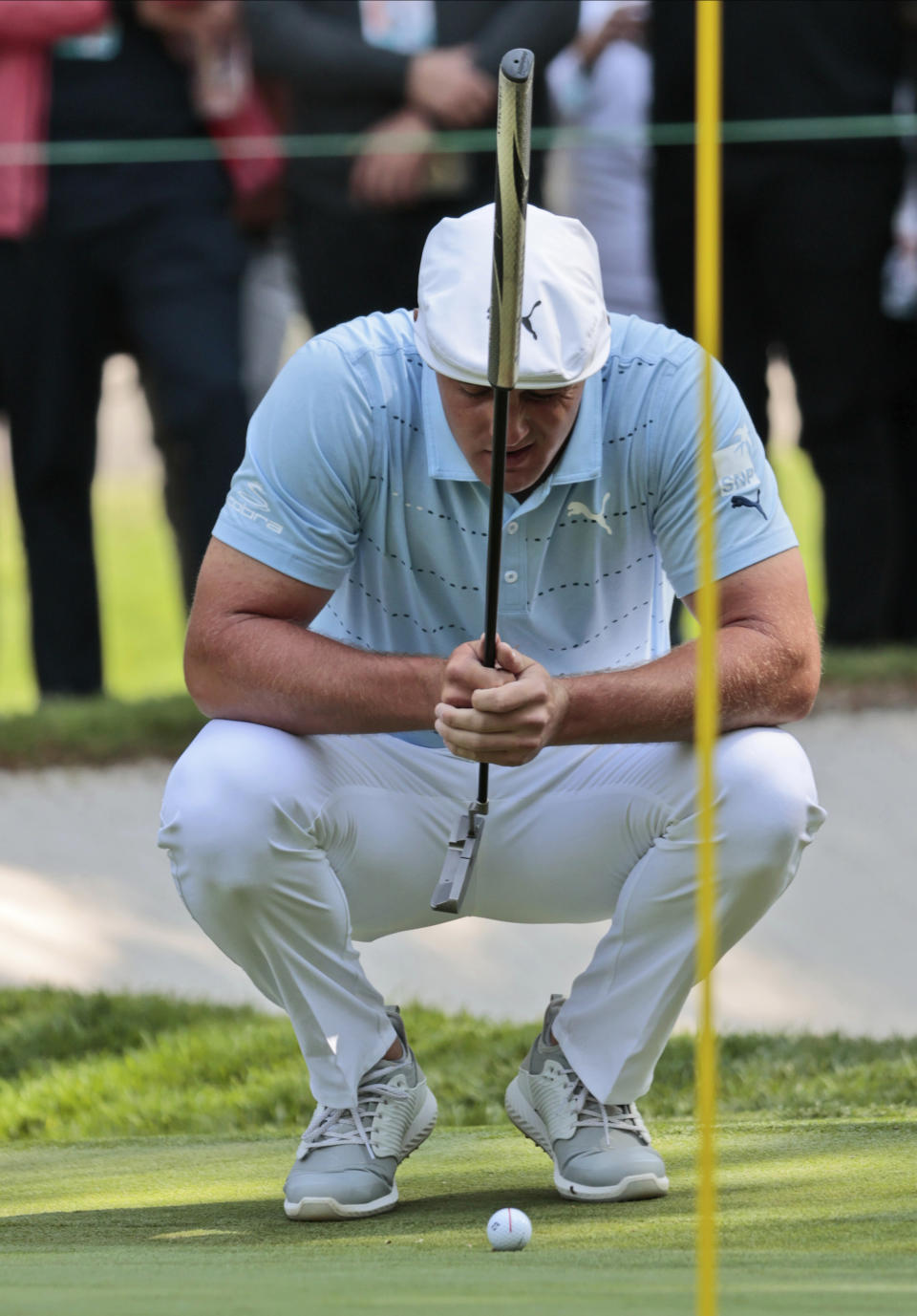 Bryson DeChambeau of the United States aligns a putt on the 9th green during the third round for the WGC-Mexico Championship golf tournament, at the Chapultepec Golf Club in Mexico City, Saturday, Feb. 22, 2020.(AP Photo/Fernando Llano)