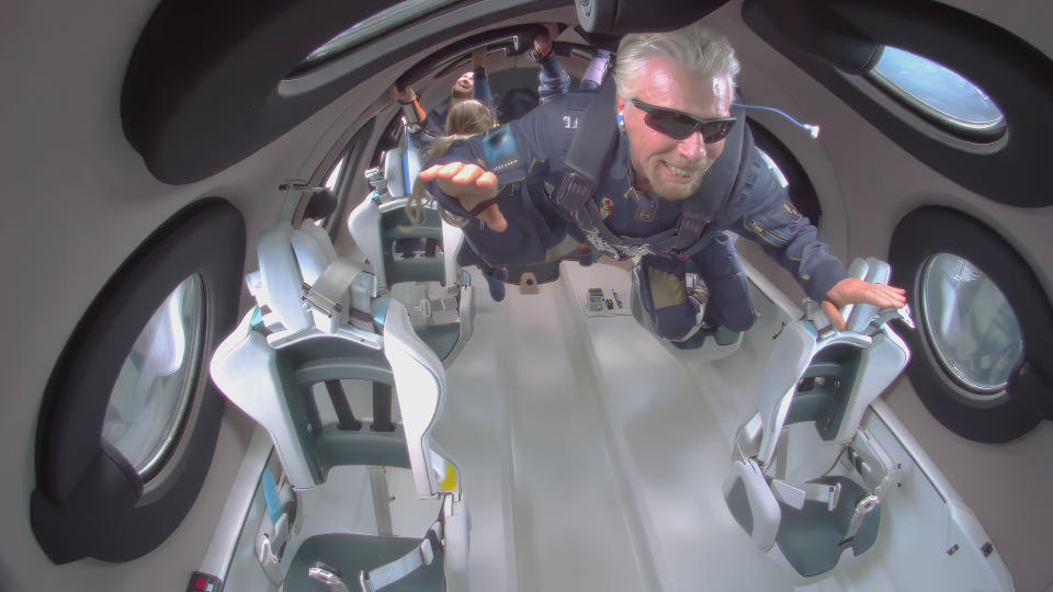 Richard Branson floats in space aboard a Virgin Galactic craft.