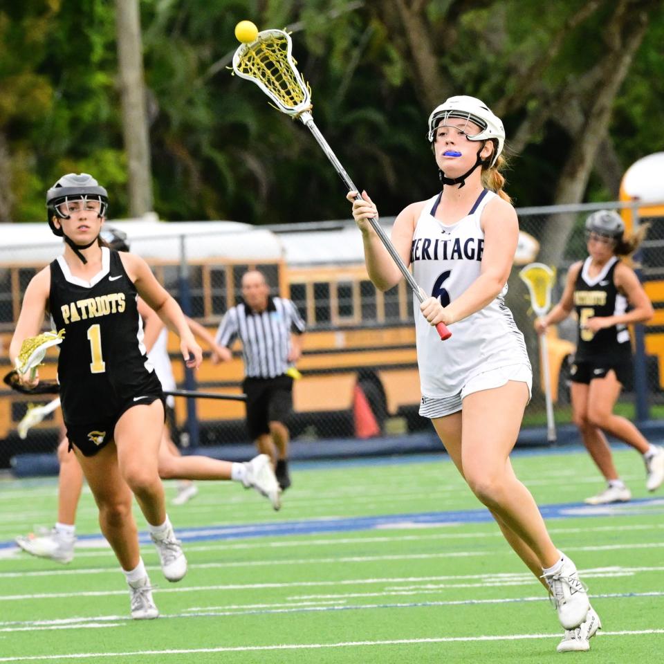 American Heritage-Delray's Ava Thompson looks to pass upfield during the Stallions' regional semifinals win on April 30, 2024.