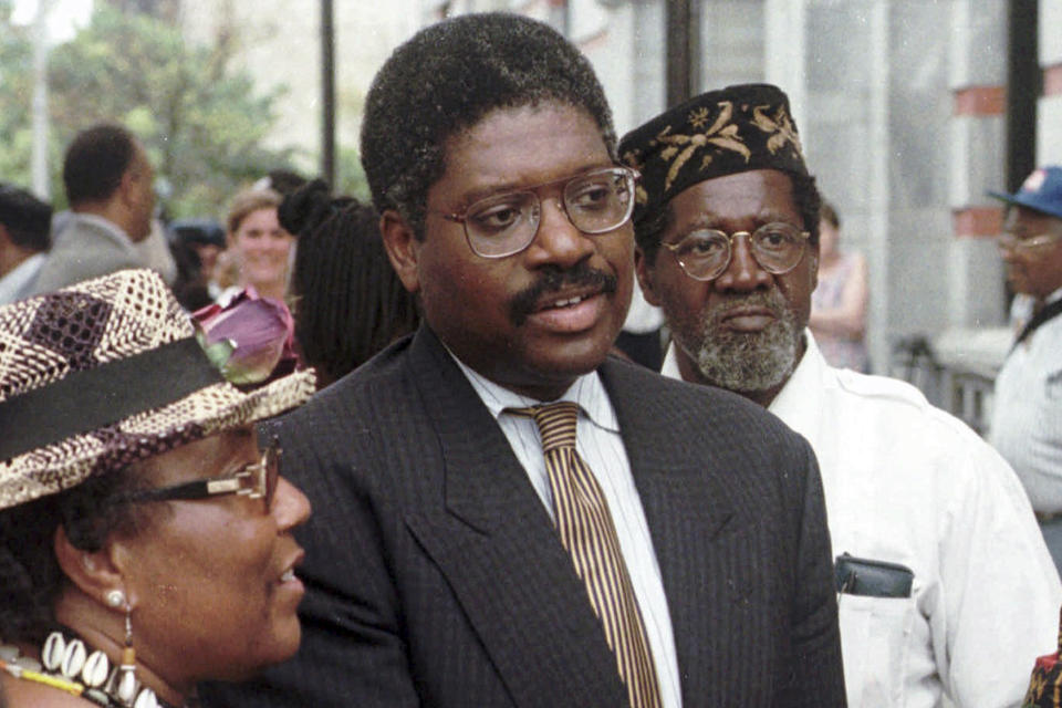 FILE — Alton Maddox Jr., center, meets with supporters in Poughkeepsie, N.Y., July 29, 1998, after a jury awarded Steven Pagones a total of $345,000 in a defamation suit against Maddox and two other advisers of Tawana Brawley. Maddox, who represented victims of several notorious racist attacks in New York in the 1980s, died Sunday, April 23, 2023 at age 77, in New York. (AP Photo/Tim Roske, File)