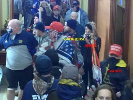 A photo in a court filing alleges to show Lawrence Stackhouse, Rachel Myers and Michael Gianos inside the U.S. Capitol during the Jan. 6 riot.