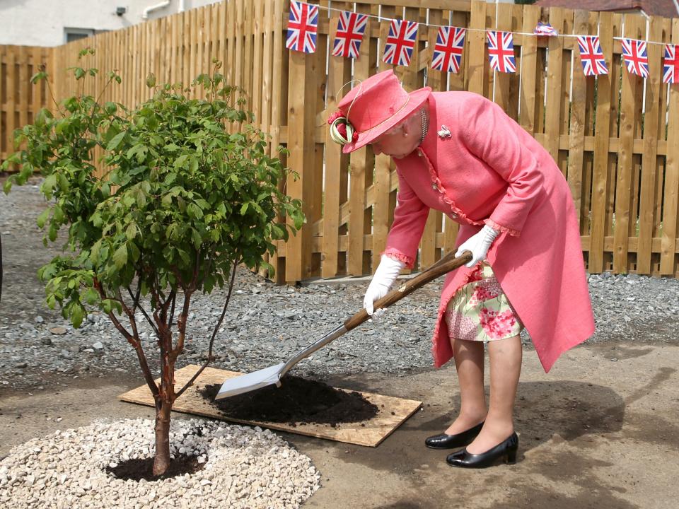 The Queen planting a tree at a disabled housing project in Edinburgh in 2015PA