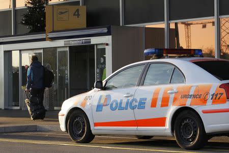 A police car is parked outside Cointrin airport in Geneva, Switzerland, December 10, 2015. REUTERS/Pierre Albouy