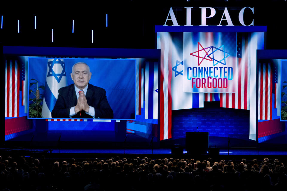 Israeli Prime Minister Benjamin Netanyahu speaks on a video from Israel to the 2019 American Israel Public Affairs Committee (AIPAC) policy conference, at Washington Convention Center, in Washington, Tuesday, March 26, 2019. (AP Photo/Jose Luis Magana)