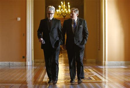 U.S. Senator Tom Coburn (R-OK) (L) and Senator Richard Burr (R-NC) (R) walk to a Republican caucus luncheon at the U.S. Capitol in Washington, January 7, 2014. REUTERS/Jonathan Ernst