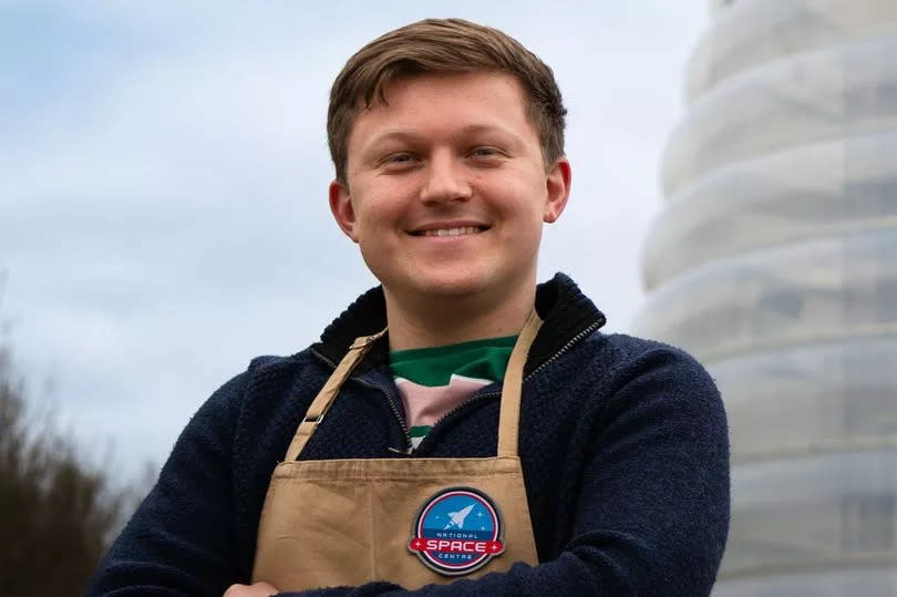 osh Smalley stands outside National Space Centre