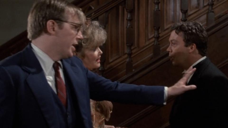 Mr. Green touching Wadsworth's shoulder in Clue