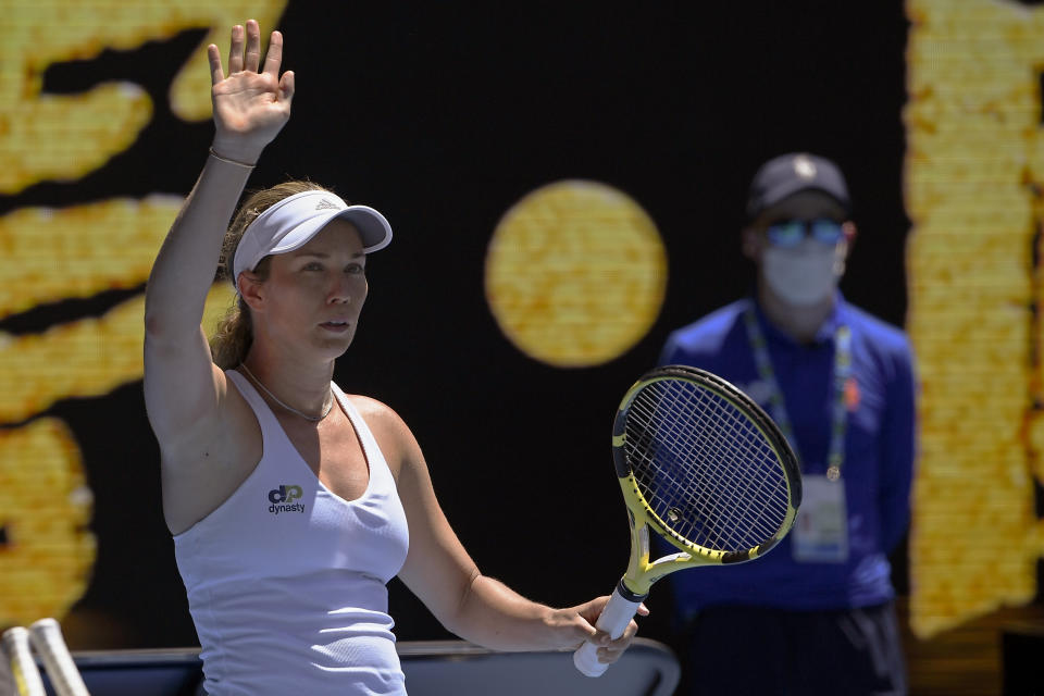 Danielle Collins of the U.S. waves after defeating Elise Mertens of Belgium during their fourth round match at the Australian Open tennis championships in Melbourne, Australia, Monday, Jan. 24, 2022.(AP Photo/Andy Brownbill)