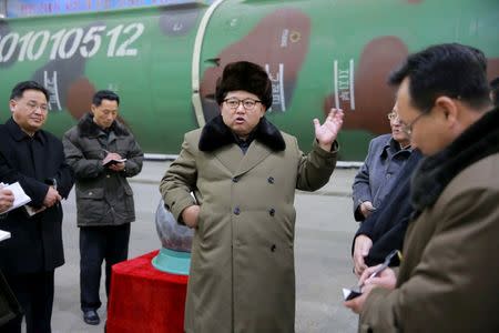 North Korean leader Kim Jong Un meets scientists and technicians in the field of research into nuclear weapons in this undated photo released by North Korea's Korean Central News Agency (KCNA) in Pyongyang March 9, 2016. REUTERS/KCNA/File Photo