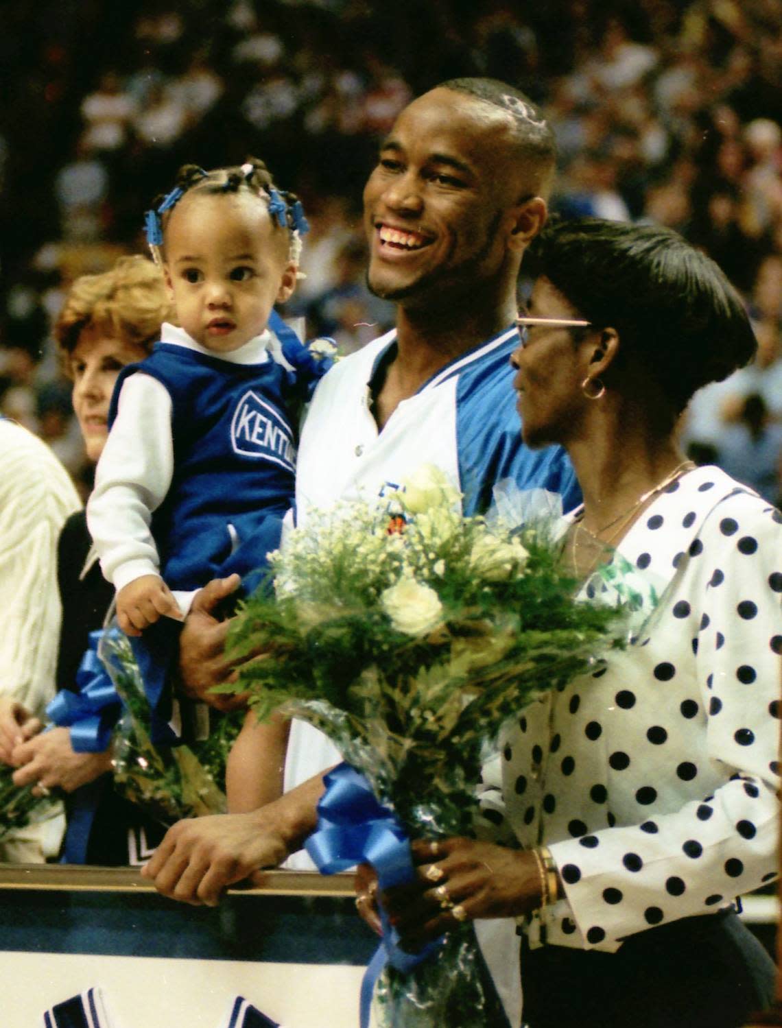 UK basketball player Anthony Epps held his daughter, Makayla, on Senior Night, 1997.