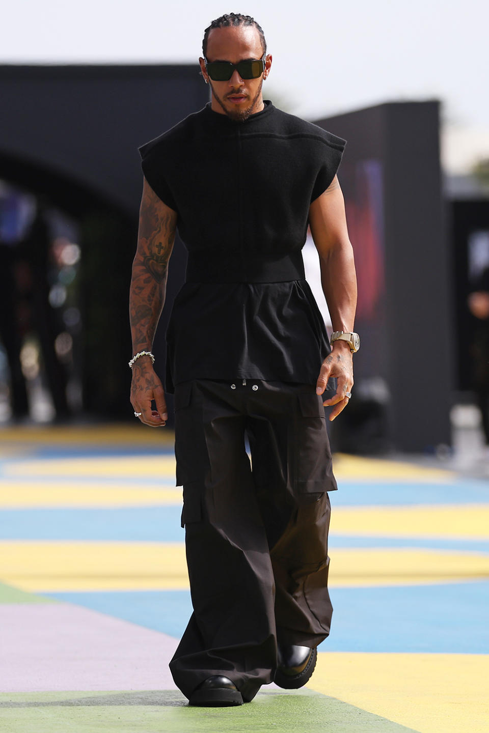 JEDDAH, SAUDI ARABIA - MARCH 18: Lewis Hamilton of Great Britain and Mercedes walks in the Paddock prior to final practice ahead of the F1 Grand Prix of Saudi Arabia at Jeddah Corniche Circuit on March 18, 2023 in Jeddah, Saudi Arabia. (Photo by Lars Baron/Getty Images)