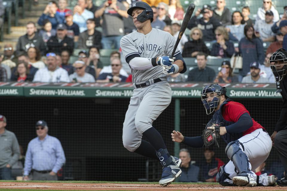 New York Yankees' Aaron Judge watches his fielders choice with Cleveland Guardians' Mike Zunino during the first inning of a baseball game in Cleveland, Tuesday April 11, 2023. (AP Photo/Phil Long)