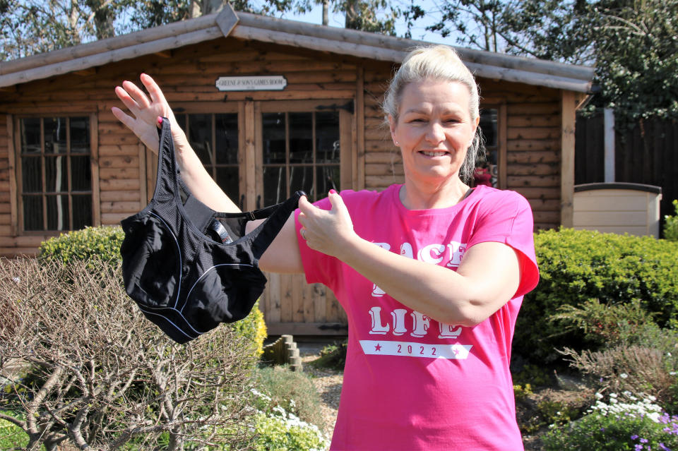 Sandra Greene holding up her sports bra. (SWNS) 