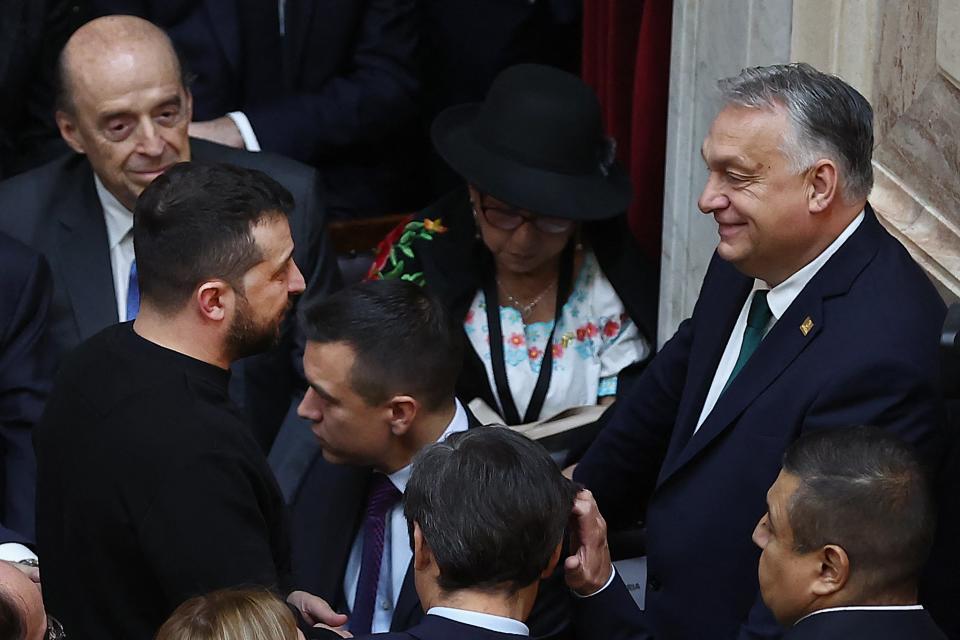 Ukraine's President Volodymyr Zelensky chats with Hungary's Prime Minister Viktor Orban during the inauguration of Argentina's new president Javier Milei (AFP via Getty Images)