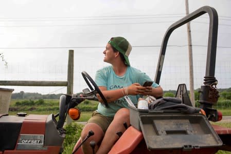 Layton Guenther, director of Quail Hill Farm, checks the sky for coming rain in Amagansett