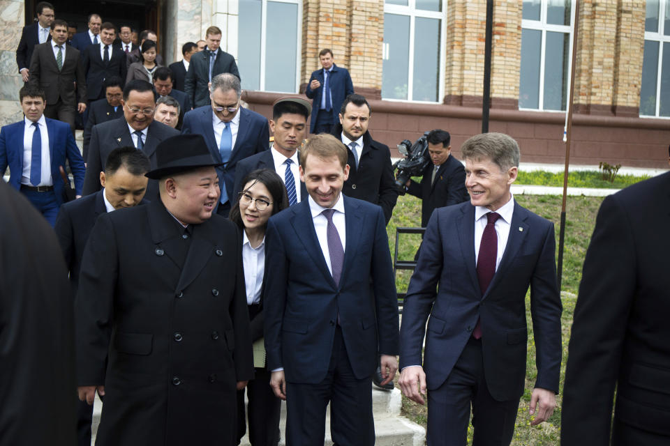 In this photo released by Press office of the administration of Primorsky Krai region, North Korea's leader Kim Jong Un, center left, Russian Minister for the development of the Russian Far East Alexander Kozlov, center, and governor of the far eastern region of Primorsky Krai Oleg Kozhemyako, right, walk at the border station of Khasan, Primorsky Krai region, Russia, Wednesday, April 24, 2019. North Korean leader Kim Jong Un arrived in Russia on Wednesday morning for his much-anticipated summit with Russian President Vladimir Putin in the Pacific port city of Vladivostok. (Alexander Safronov/Press Office of the Primorye Territory Administration via AP)