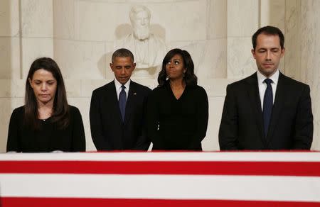 U.S. President Barack Obama and first lady Michelle Obama pay their respects to U.S. Supreme Court Justice Antonin Scalia as Scalia's body lies in repose in the Supreme Court's Great Hall in Washington February 19, 2016. Scalia died on February 13, 2016 at the age of 79. REUTERS/Kevin Lamarque