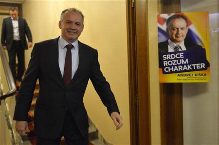 Candidate for the presidential election Andrej Kiska arrives at a party election centre to observe the ongoing election results in Bratislava March 15, 2014. REUTERS/Radovan Stoklasa