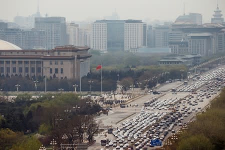 Cars line Chang'an Avenue at Tiananmen Square in Beijing