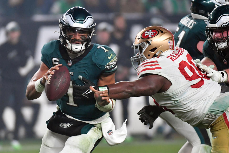 Dec 3, 2023; Philadelphia, Pennsylvania, USA; Philadelphia Eagles quarterback Jalen Hurts (1) is tackled by San Francisco 49ers defensive tackle Javon Hargrave (98) during the fourth quarter at Lincoln Financial Field. Mandatory Credit: Eric Hartline-USA TODAY Sports