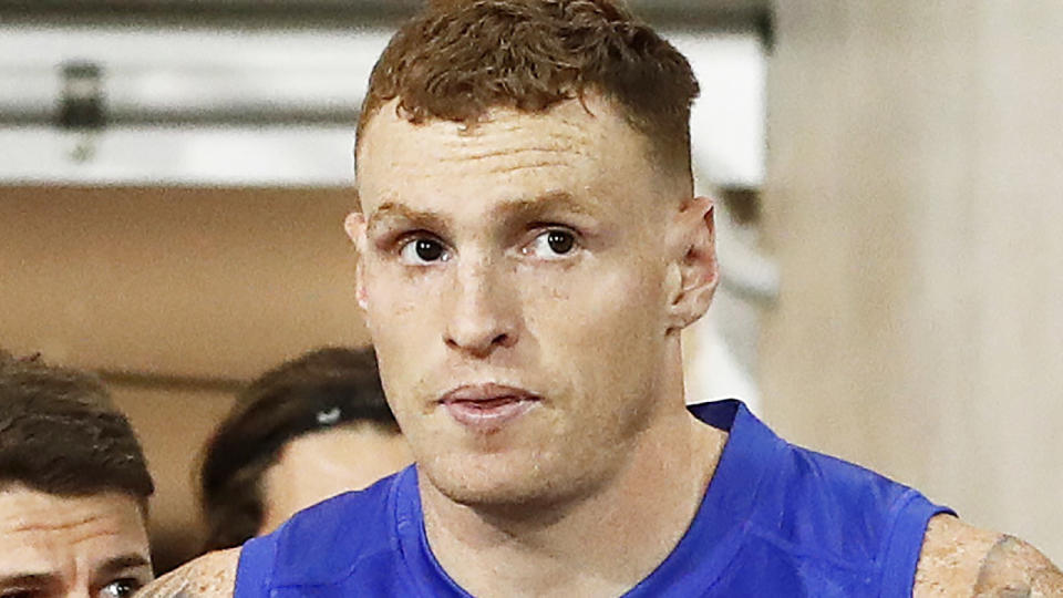 Brisbane Lions star Mitch Robinson is pictured leading his team onto the field.