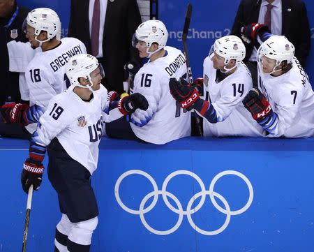 Ice Hockey - Pyeongchang 2018 Winter Olympics - Men's Quarterfinal Match - Czech Republic v U.S. - Gangneung Hockey Centre, Gangneung, South Korea - February 21, 2018 - Jim Slater of U.S. celebrates his second period goal with teammates on the bench. REUTERS/Brian Snyder