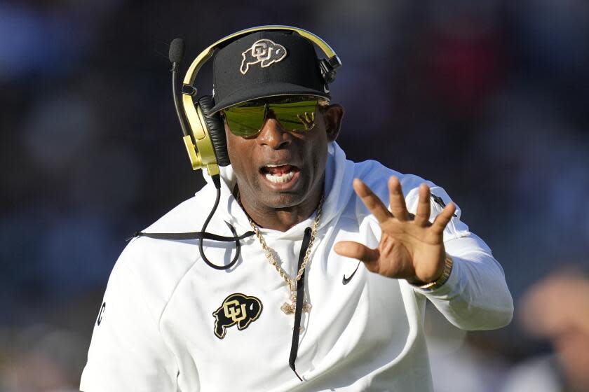 Colorado head coach Deion Sanders shouts at an official during the first half.