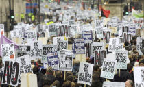 FILE - In this Feb. 15, 2003 file photo, anti-war protesters pack London's Whitehall during a march to demonstrate against a possible war against Iraq. The tumult was one of the great crises to afflict Britain in the postwar period, the latest of which relates to the country's struggles to leave the European Union. (AP Photo/Alastair Grant, File)