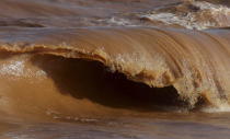 A wave is pictured on the sea near the mouth of Rio Doce on the coast of Espirito Santo in Regencia Village, Brazil, November 22, 2015. REUTERS/Ricardo Moraes